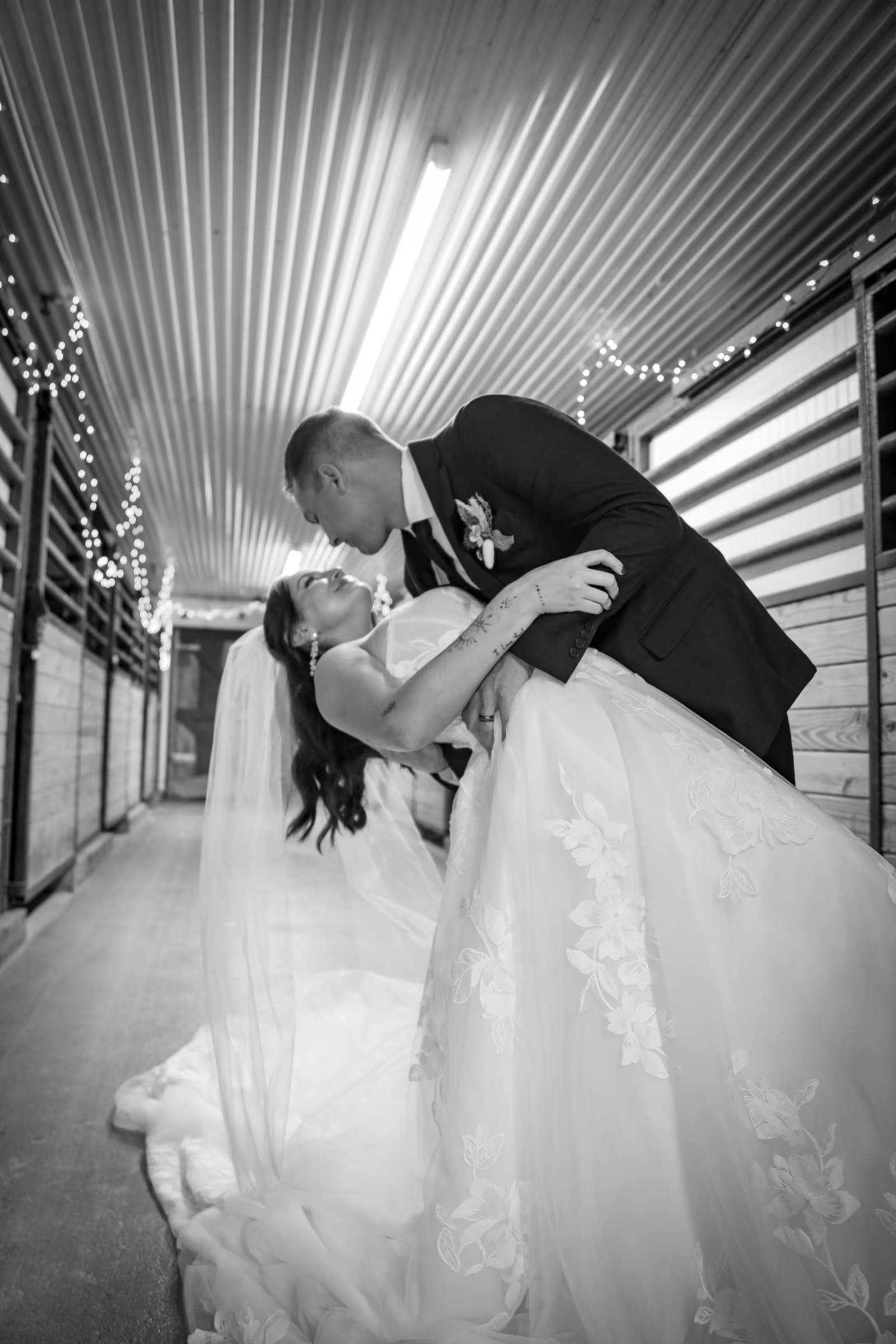 Black and white, a dip under string lights
