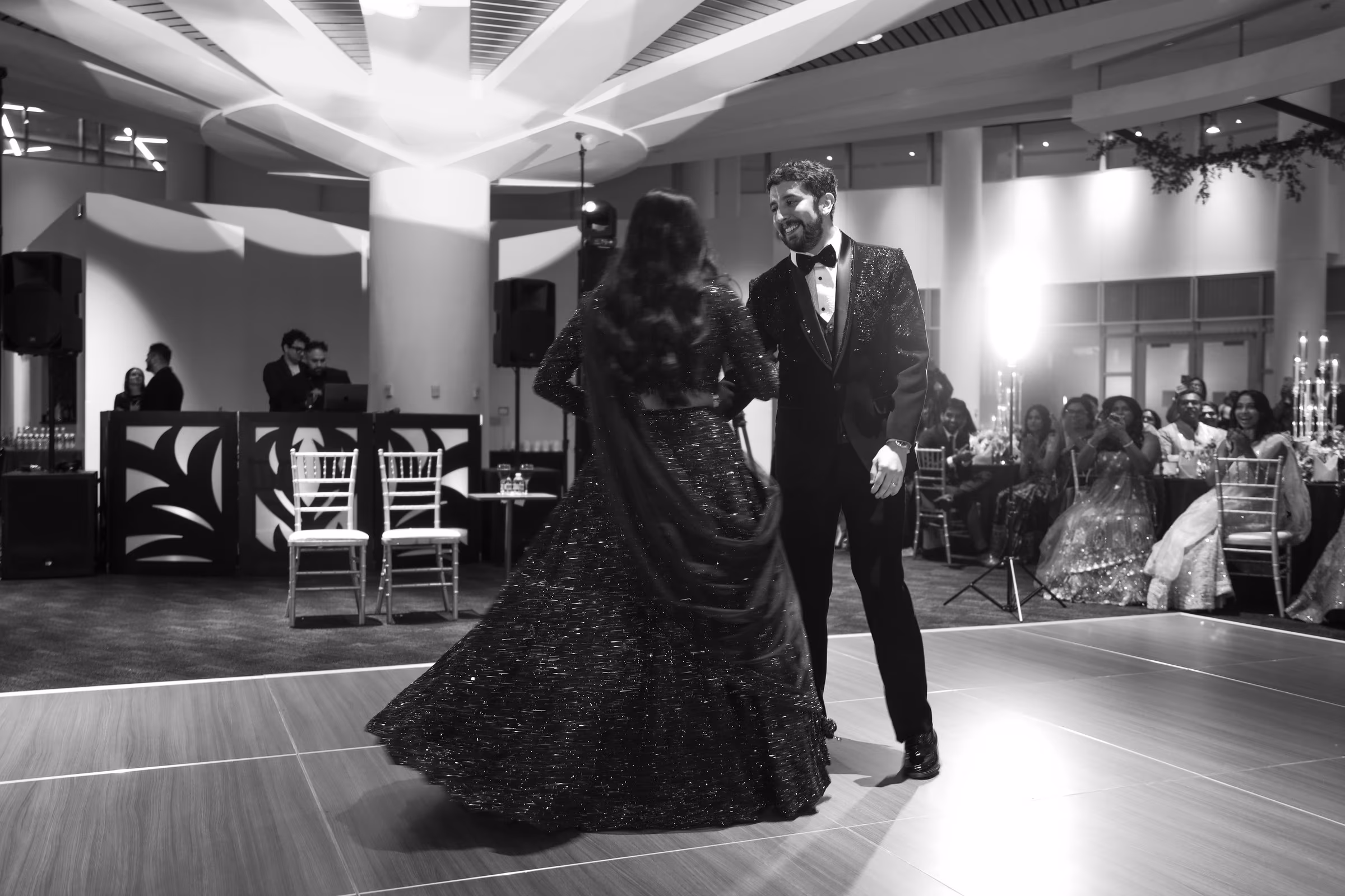 Black and white, first dance in a wide empty room