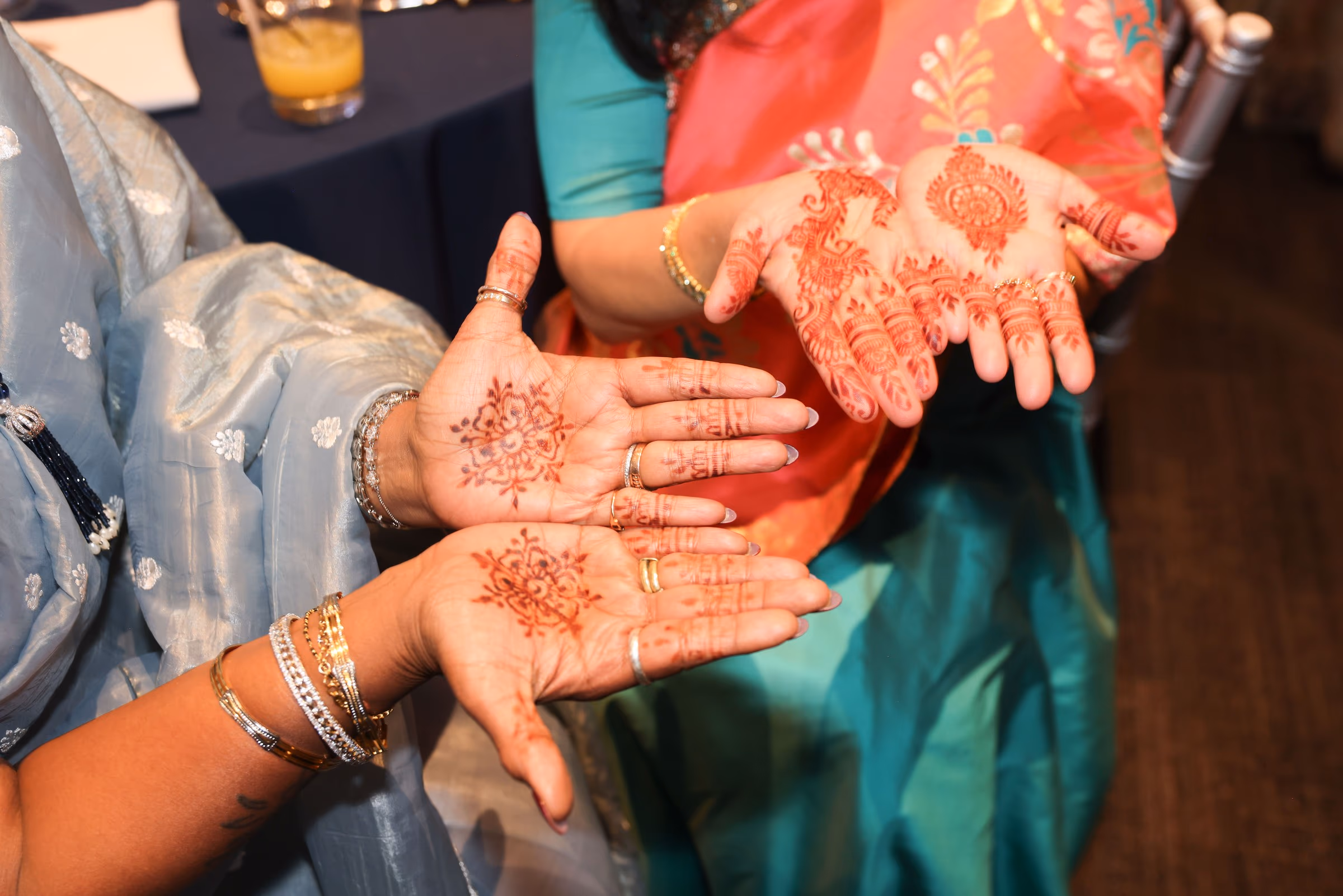 Hands with mehndi, held out